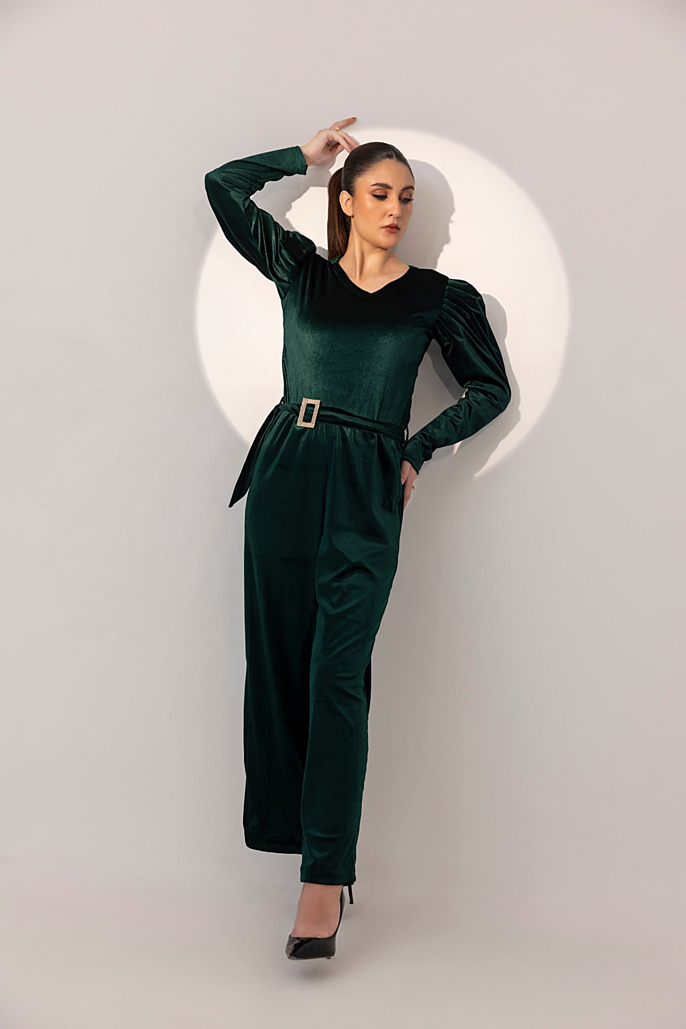 Women's green velvet jumpsuit.