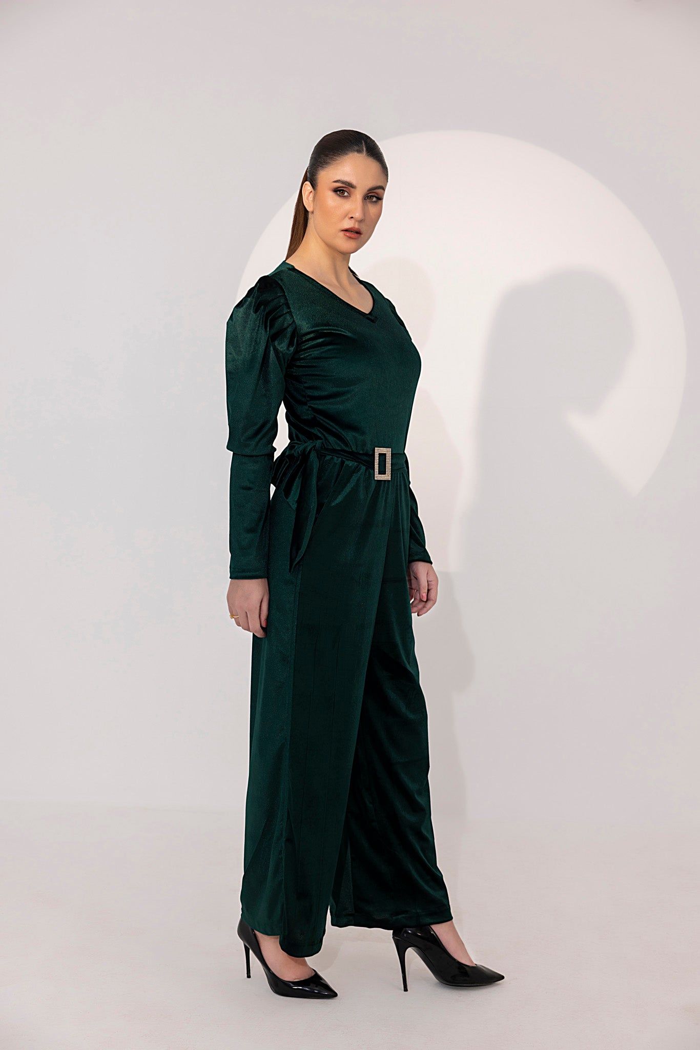 Women's green velvet jumpsuit.