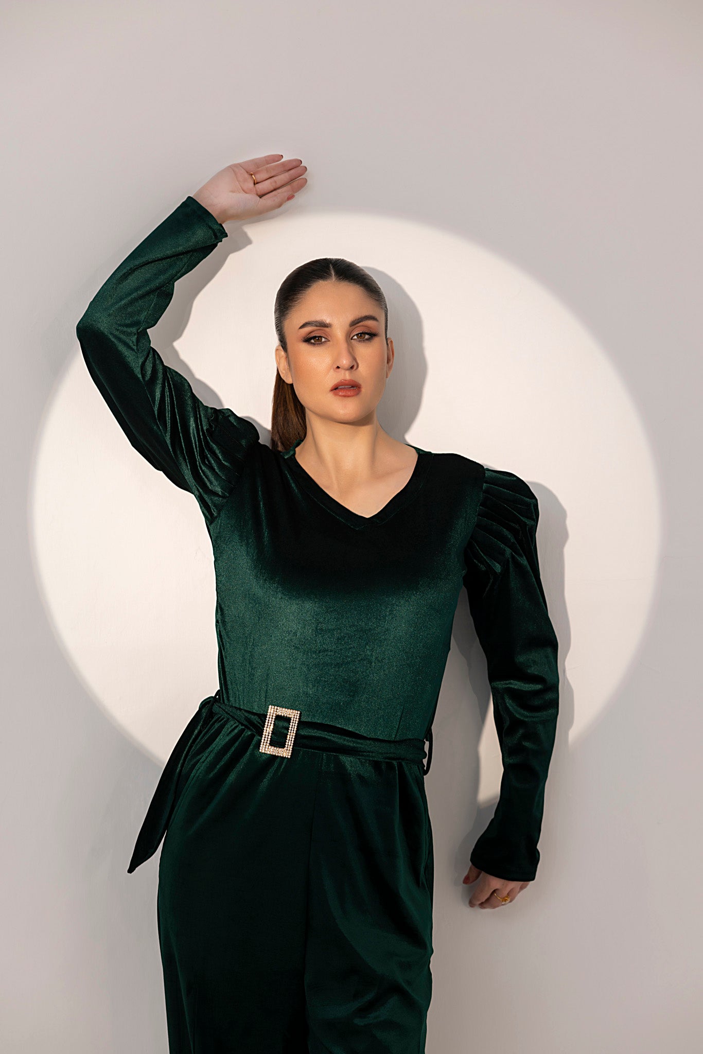 Women's green velvet jumpsuit.