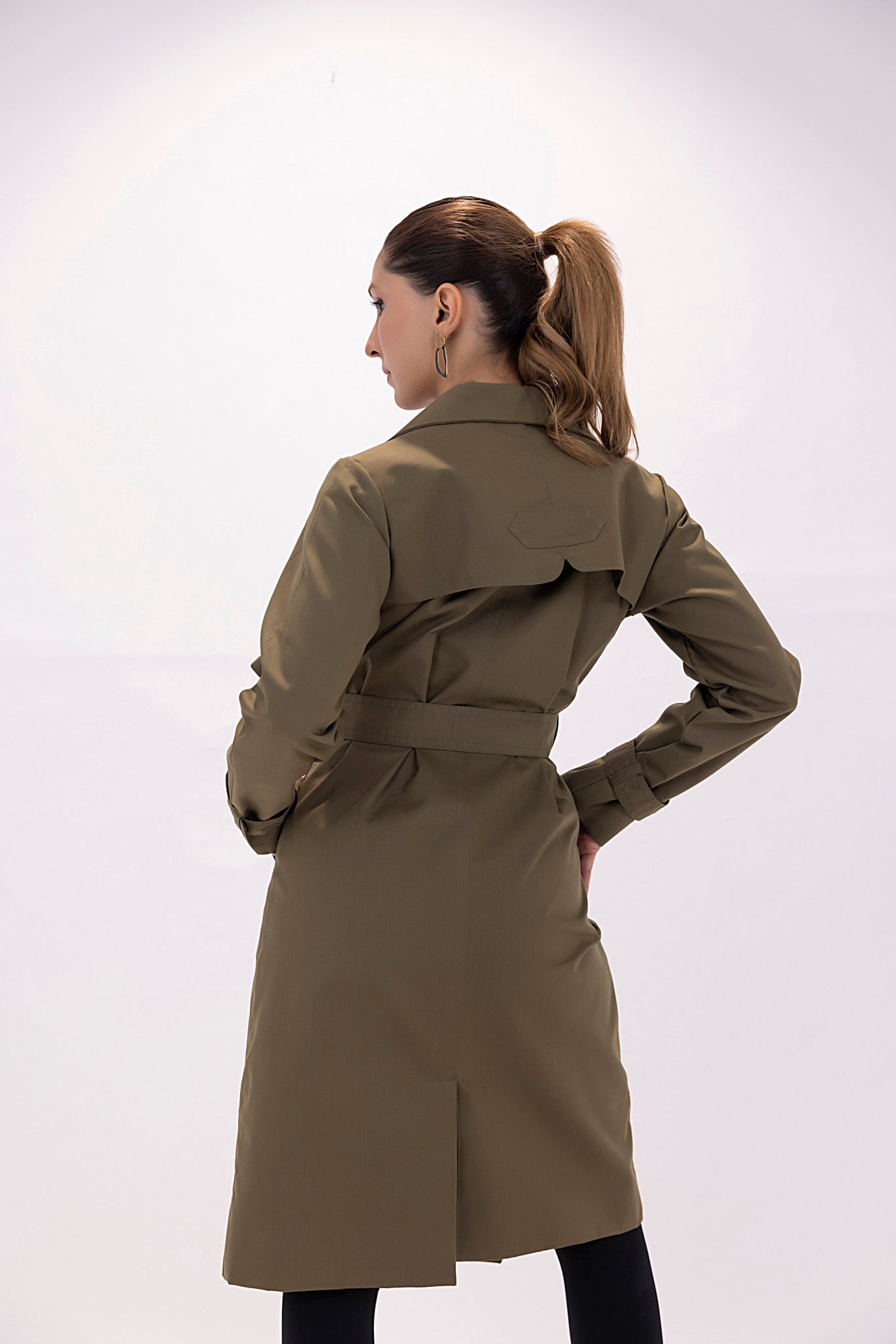 Women's twill elegant dark green trenchcoat.