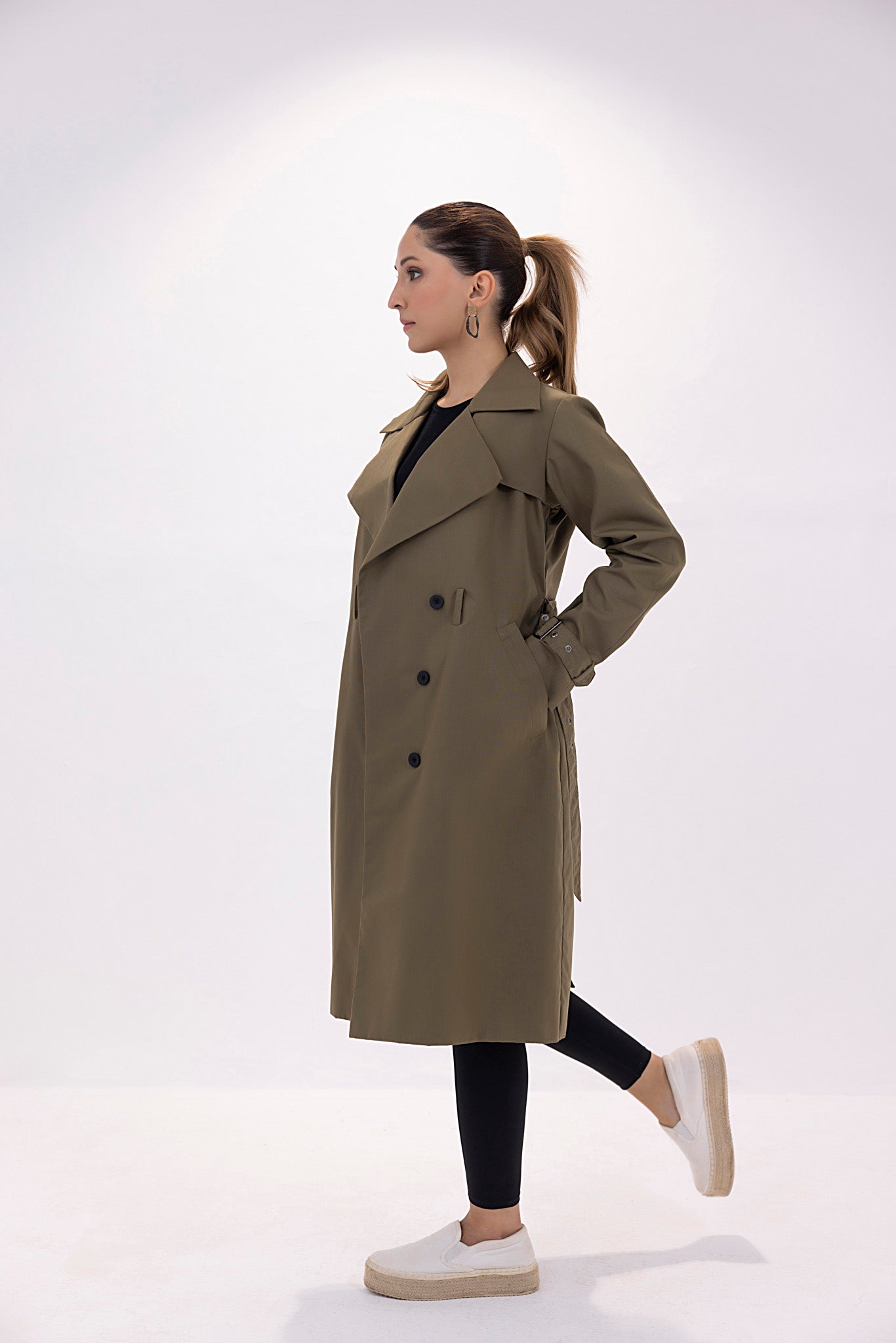 Women's twill elegant dark green trenchcoat.