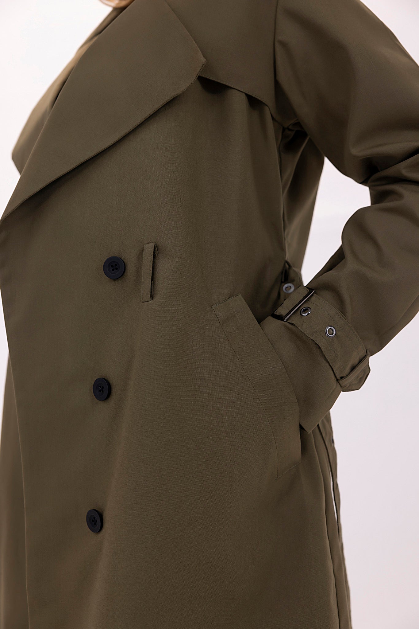 Women's twill elegant dark green trenchcoat.