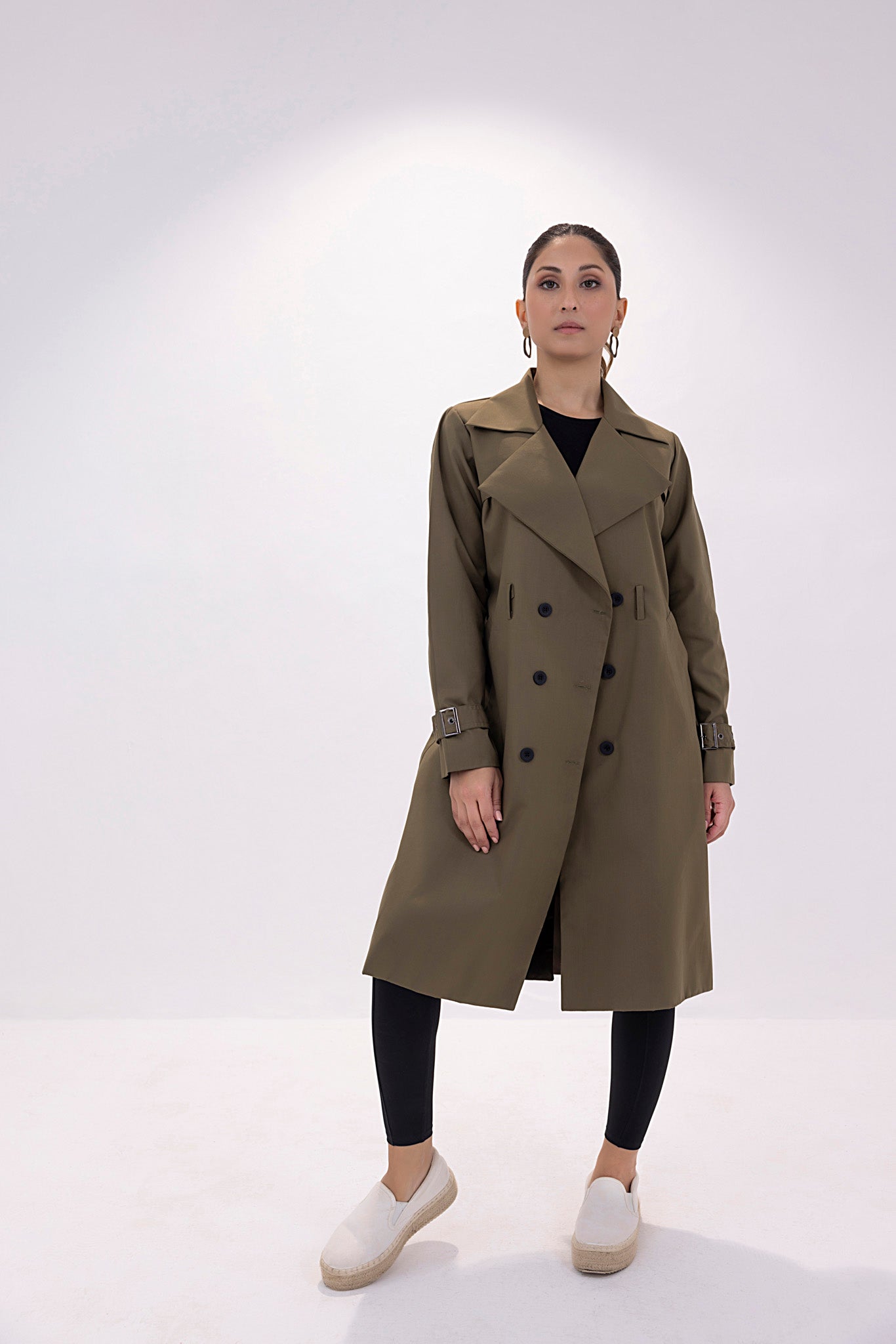 Women's twill elegant dark green trenchcoat.