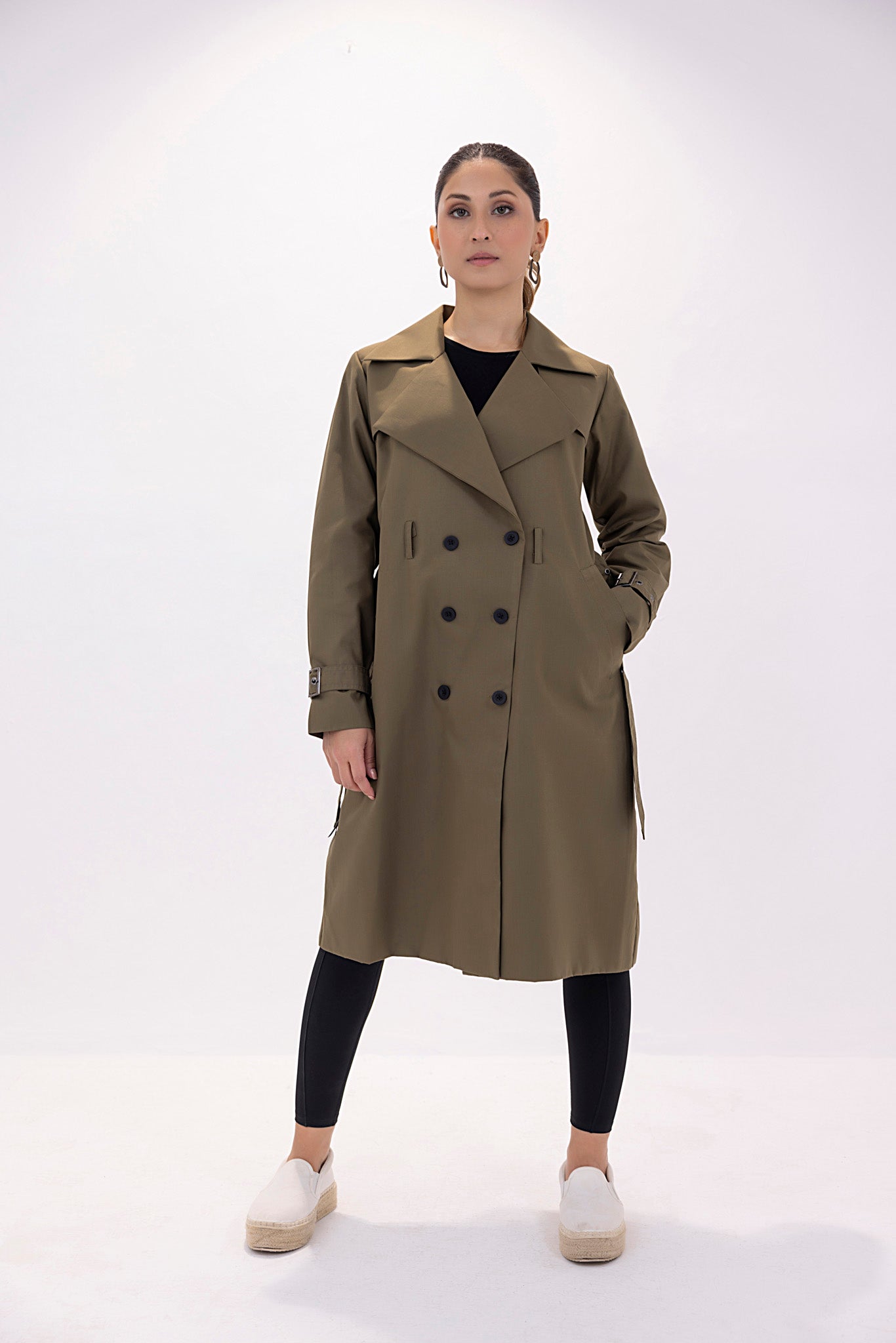 Women's twill elegant dark green trenchcoat.