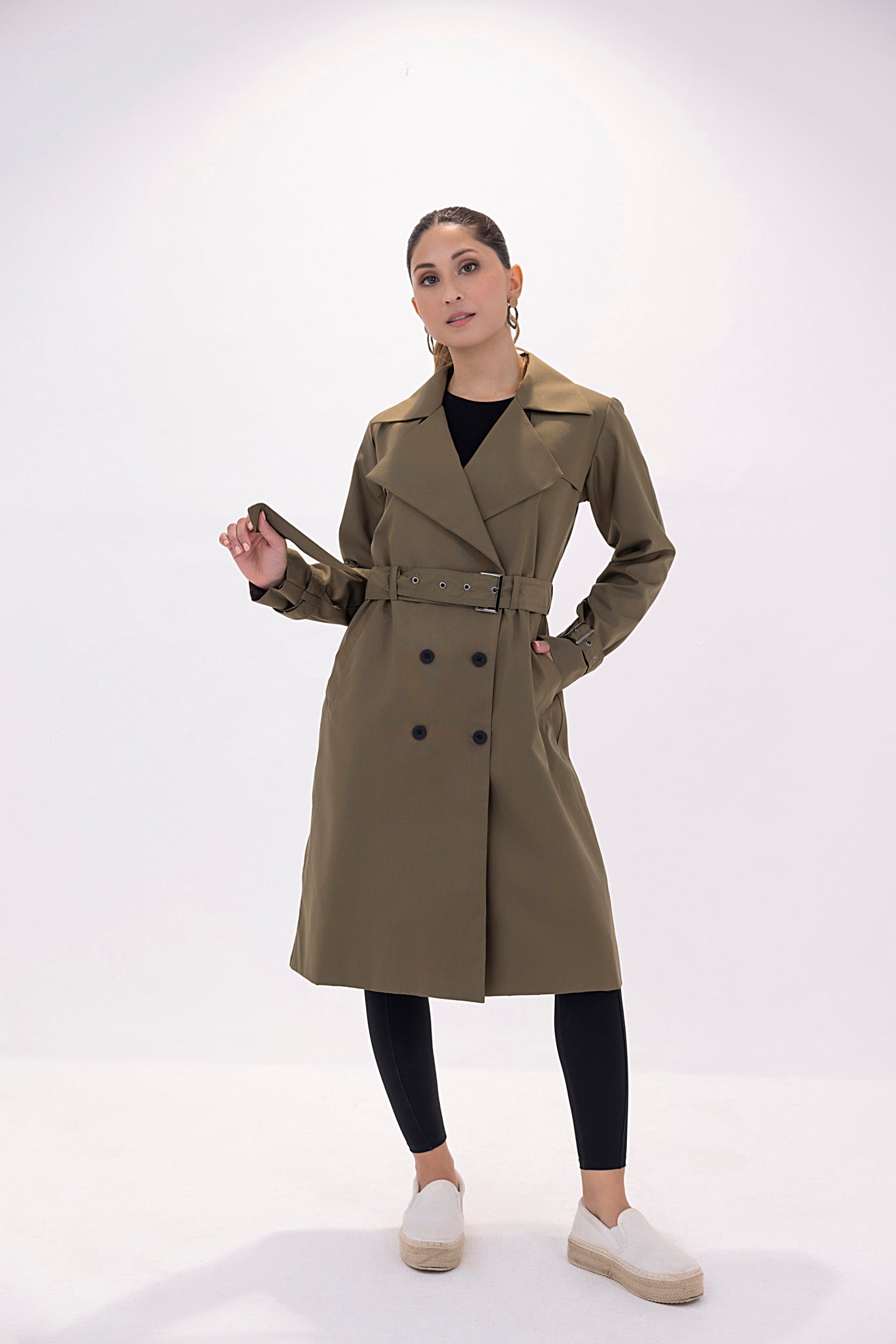 Women's twill elegant dark green trenchcoat.