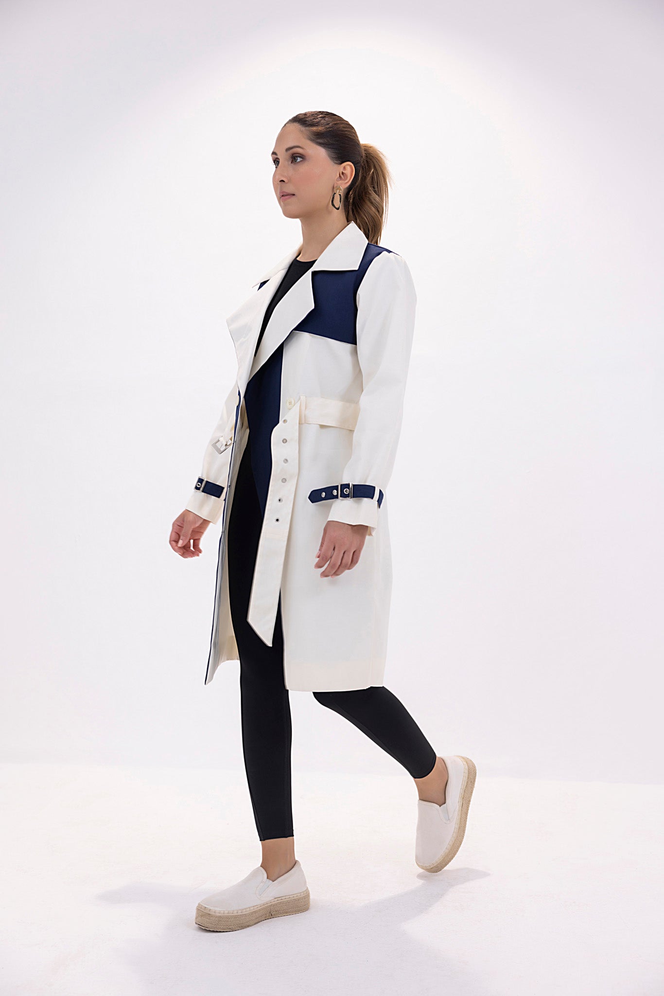 Women's twill navy and white trenchcoat.