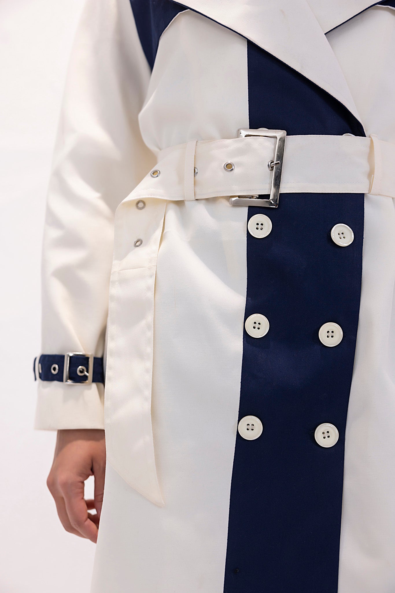 Women's twill navy and white trenchcoat.