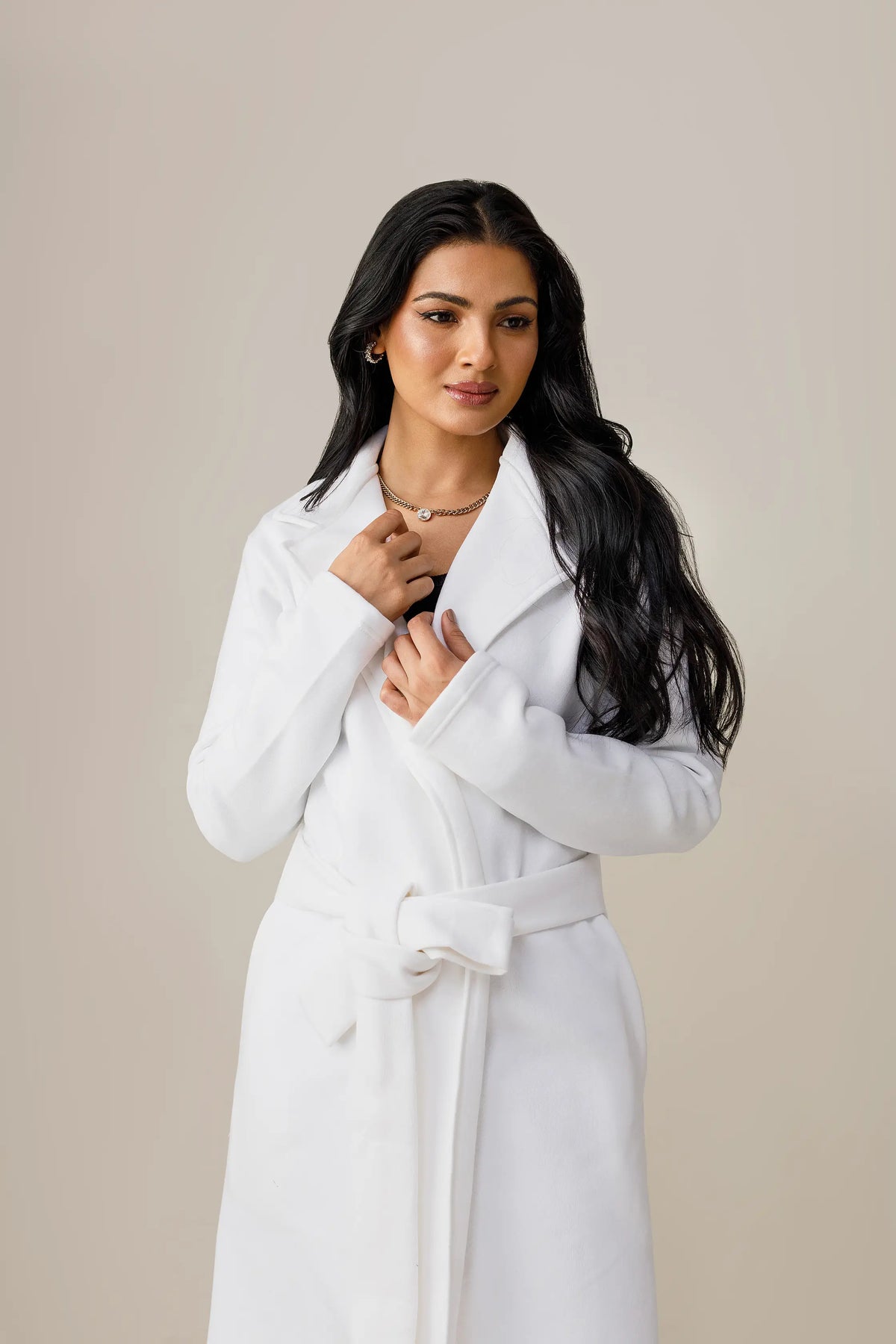 Women's white long lapel coat.