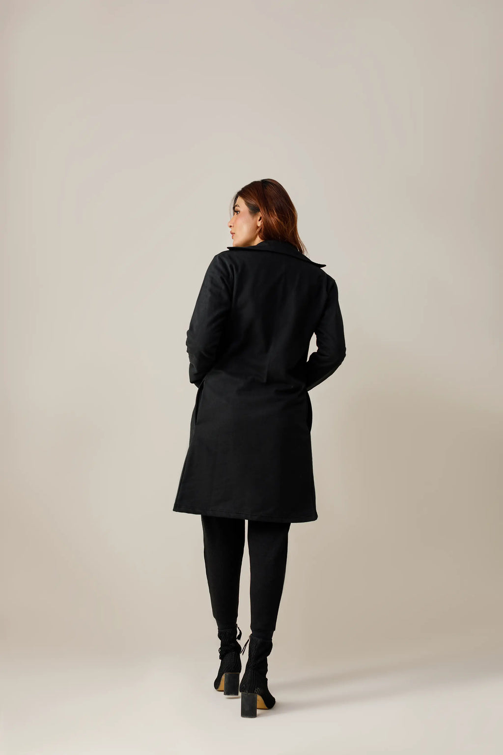 Women's black short lapel coat.