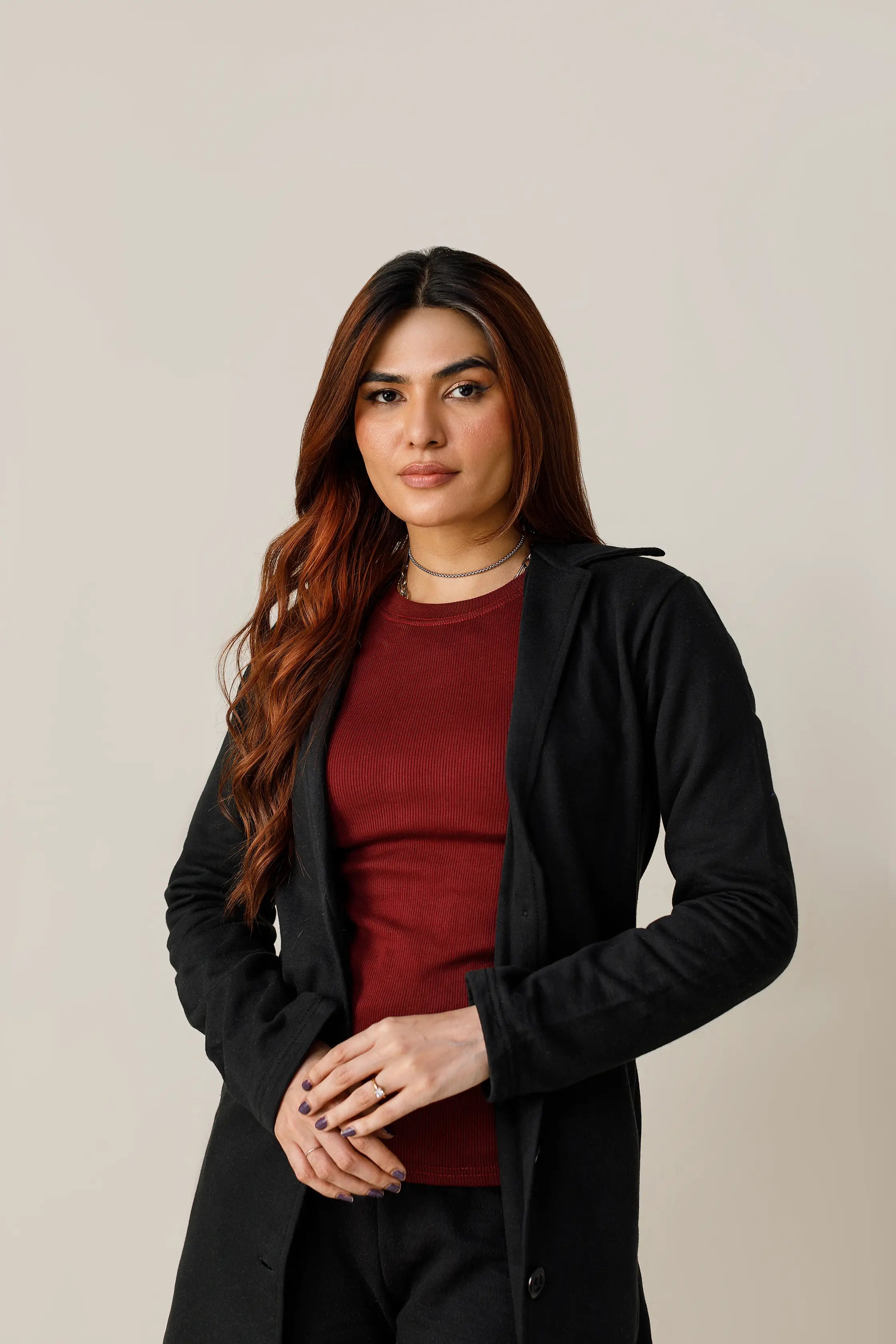 Women's black short lapel coat.