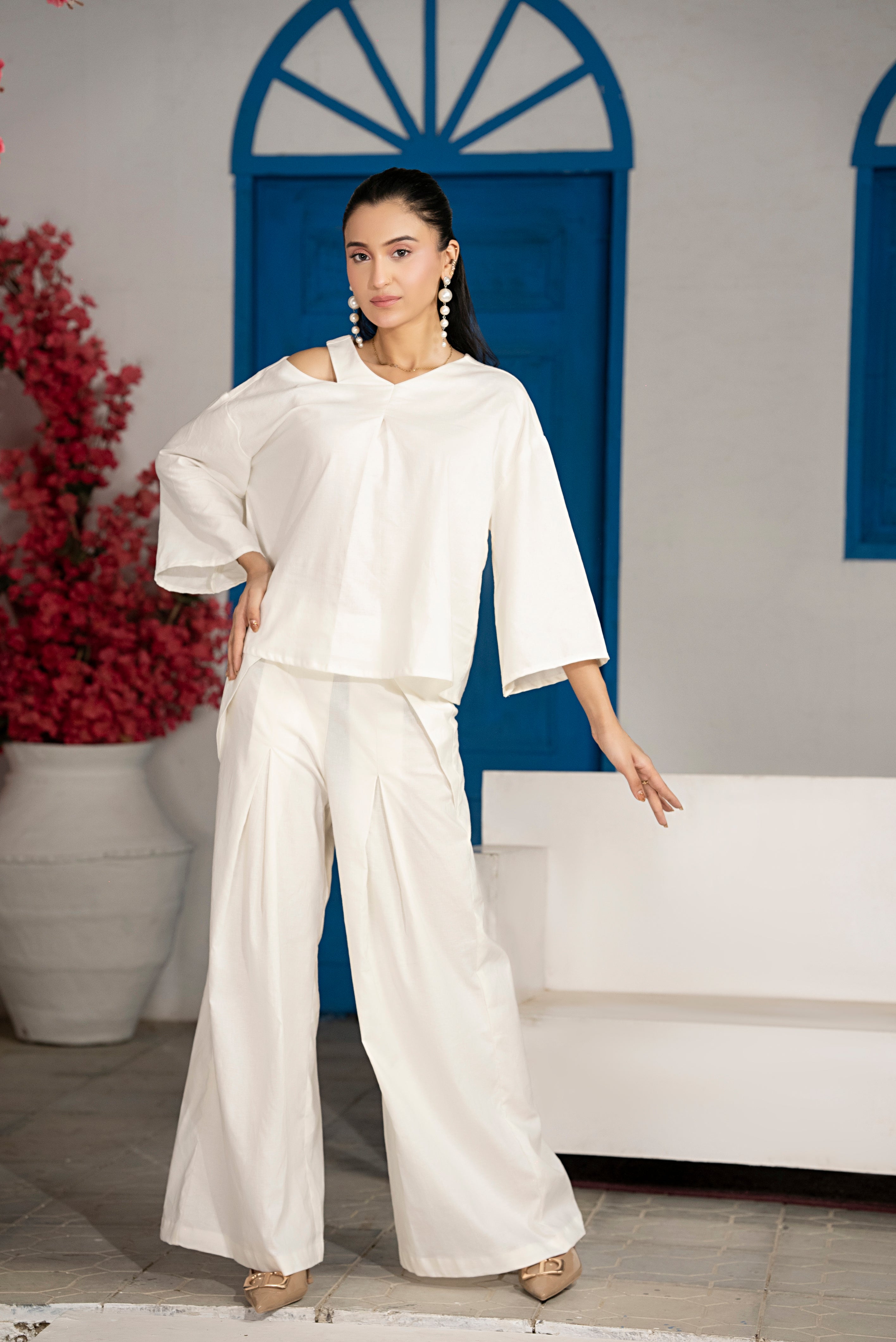 Front view of Ivorycrest Slit-Pleat Co-Ord Set in off-white with shoulder slit, chest pleat and wide-leg trousers