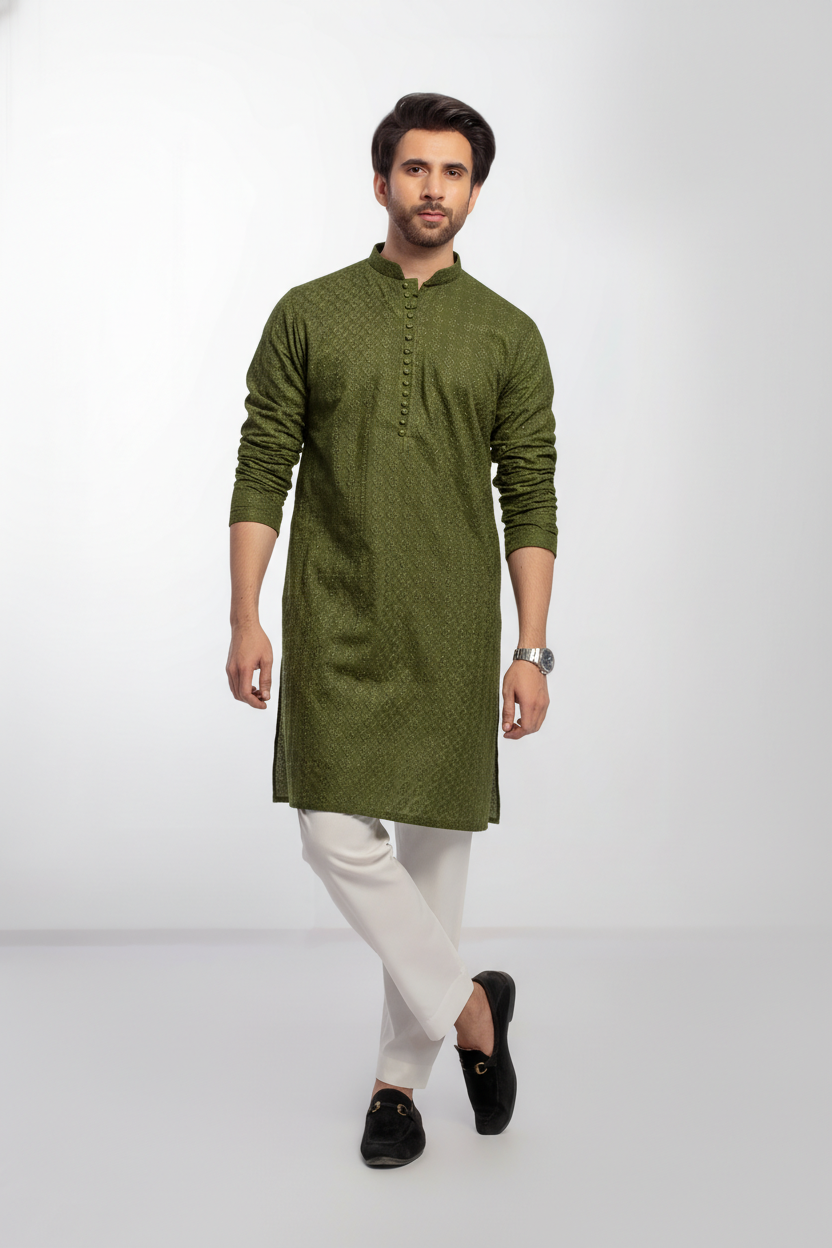 Man wearing a green kurta with white pajama on a light gray background